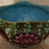 Old earthenware cachepot with flower decoration
