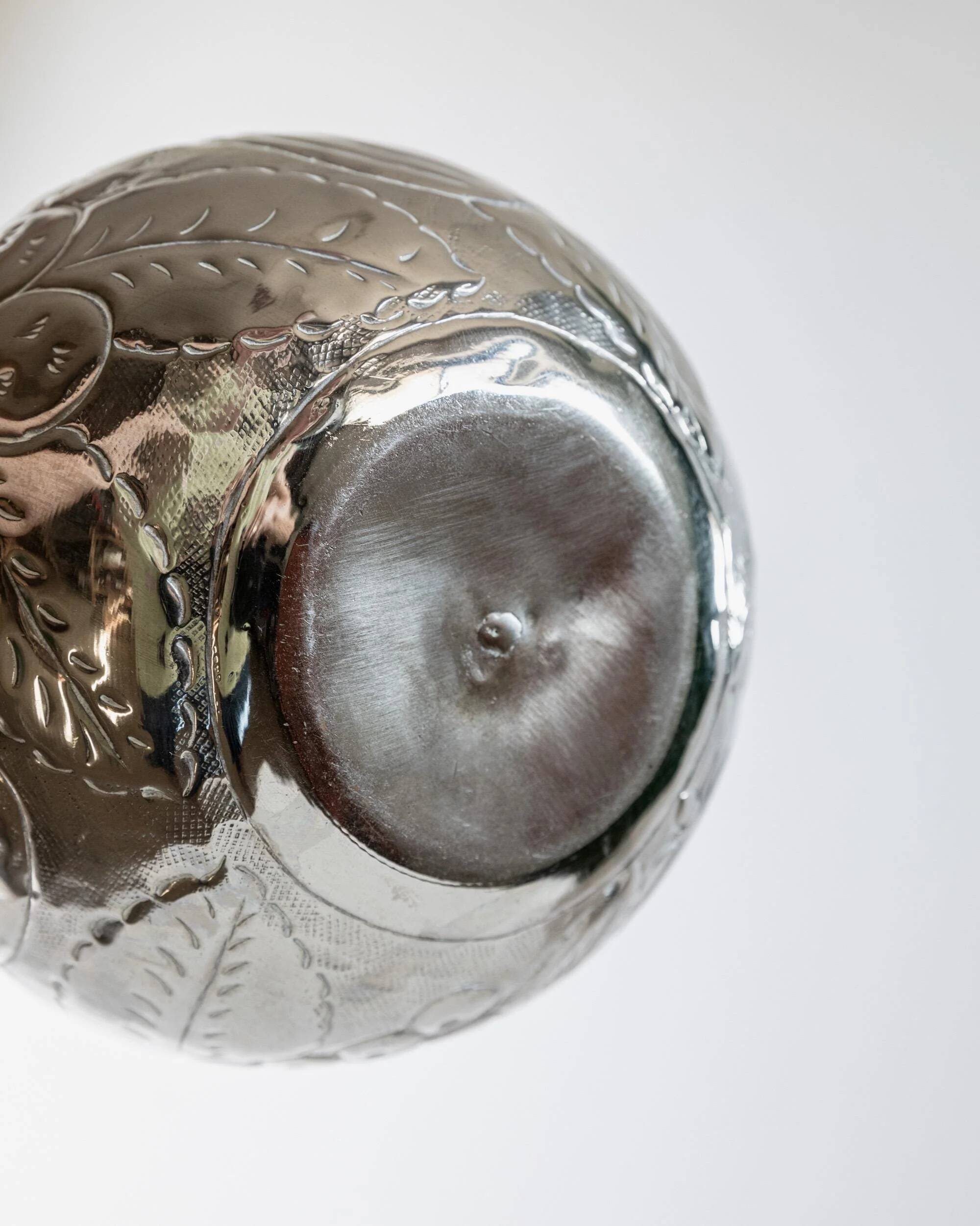 Vintage Italian vase in nickel-plated brass from the 1960s, hand-hammered relief of fruits and leaves.