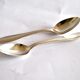 Set of 2 silver-plated teaspoons with a gold filigree design, 13.5 cm.