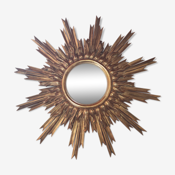 Sun mirror and witch's eye in gilded wood