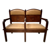 Art Deco two-seater bench in solid mahogany, 20th century.