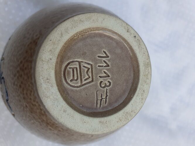 Enamelled sandstone vase