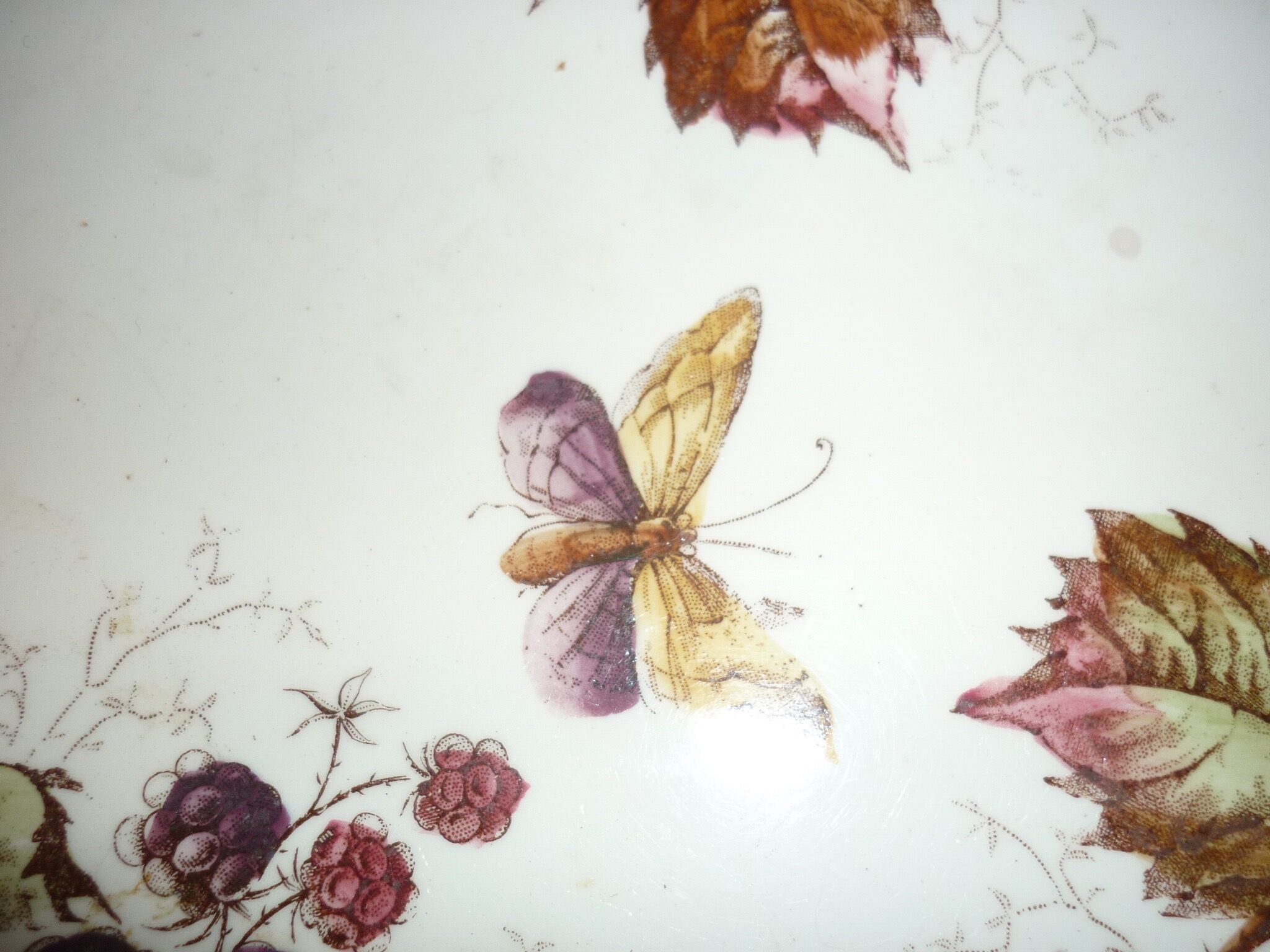 Ceramic plate underside on bronze stand