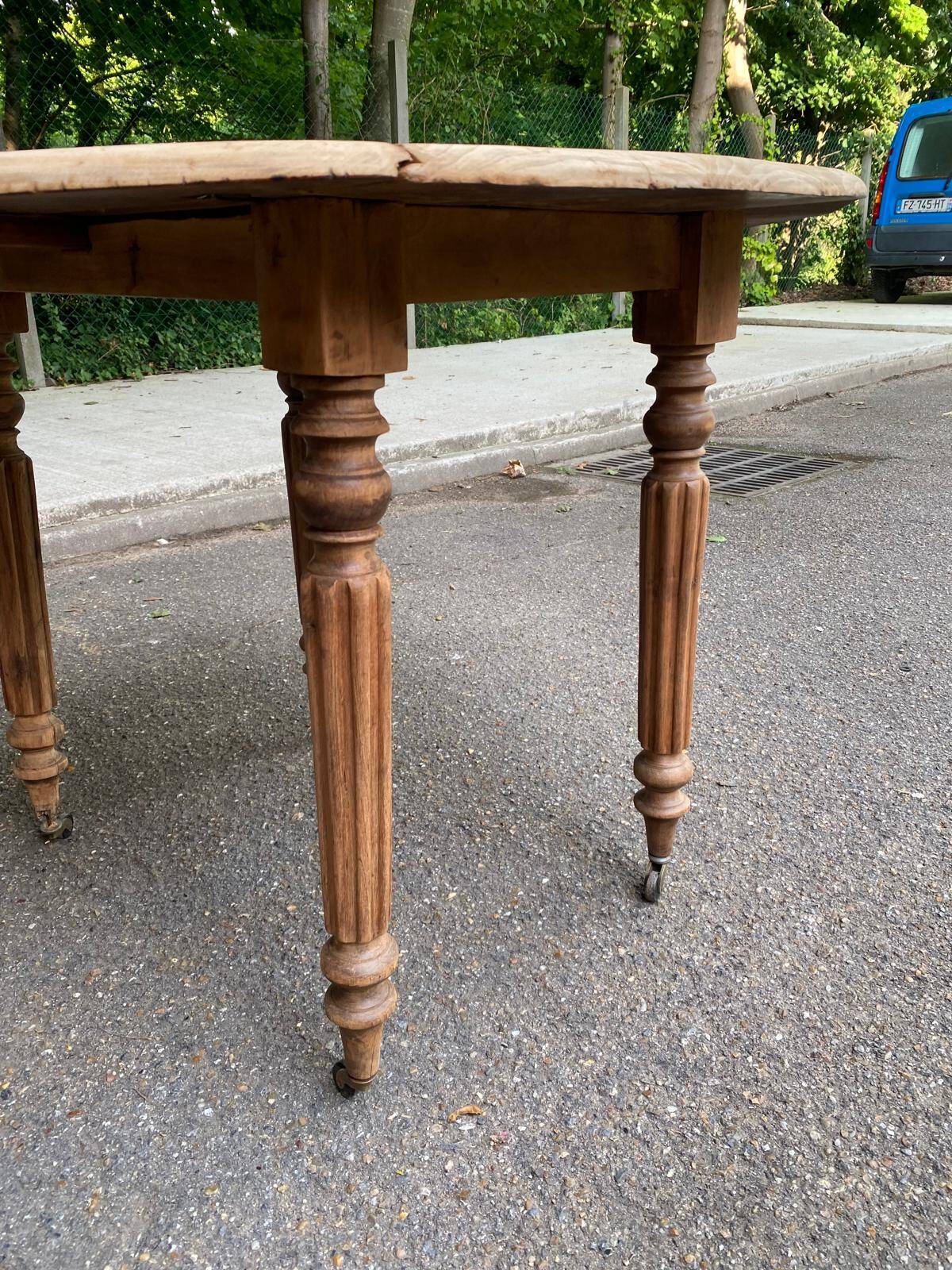 Renovated 18th century solid wood extendable round dining table with shutters