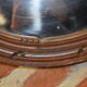 Oval mirror with a node