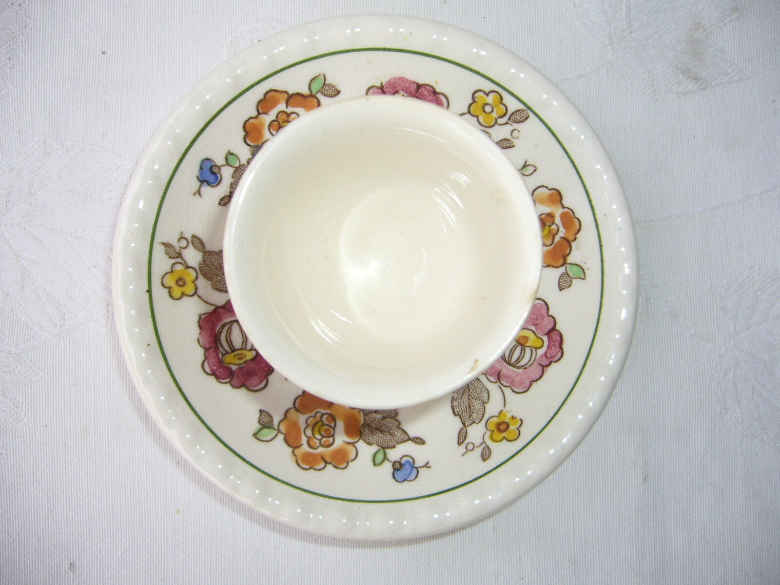 old-time cockroach with floral decoration with its cup