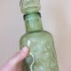 Duo of vintage bottles in Italian glass