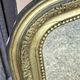 Louis Philippe mirror in gilded wood with an openwork frieze.