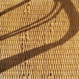 Wicker or rattan armchairs and bamboo