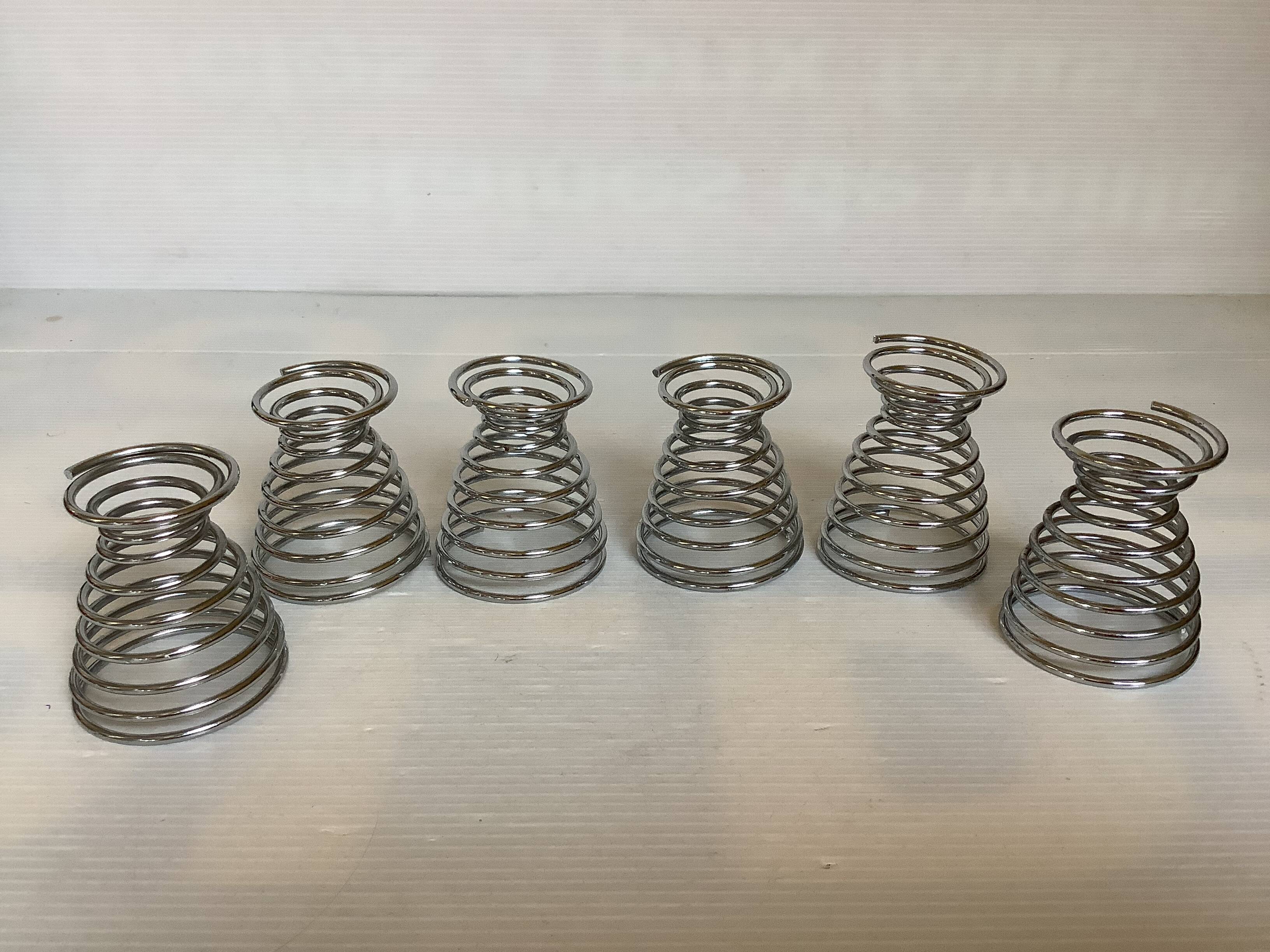 Six metal spiral egg cups