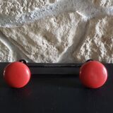 Metal coat rack with 2 red hooks