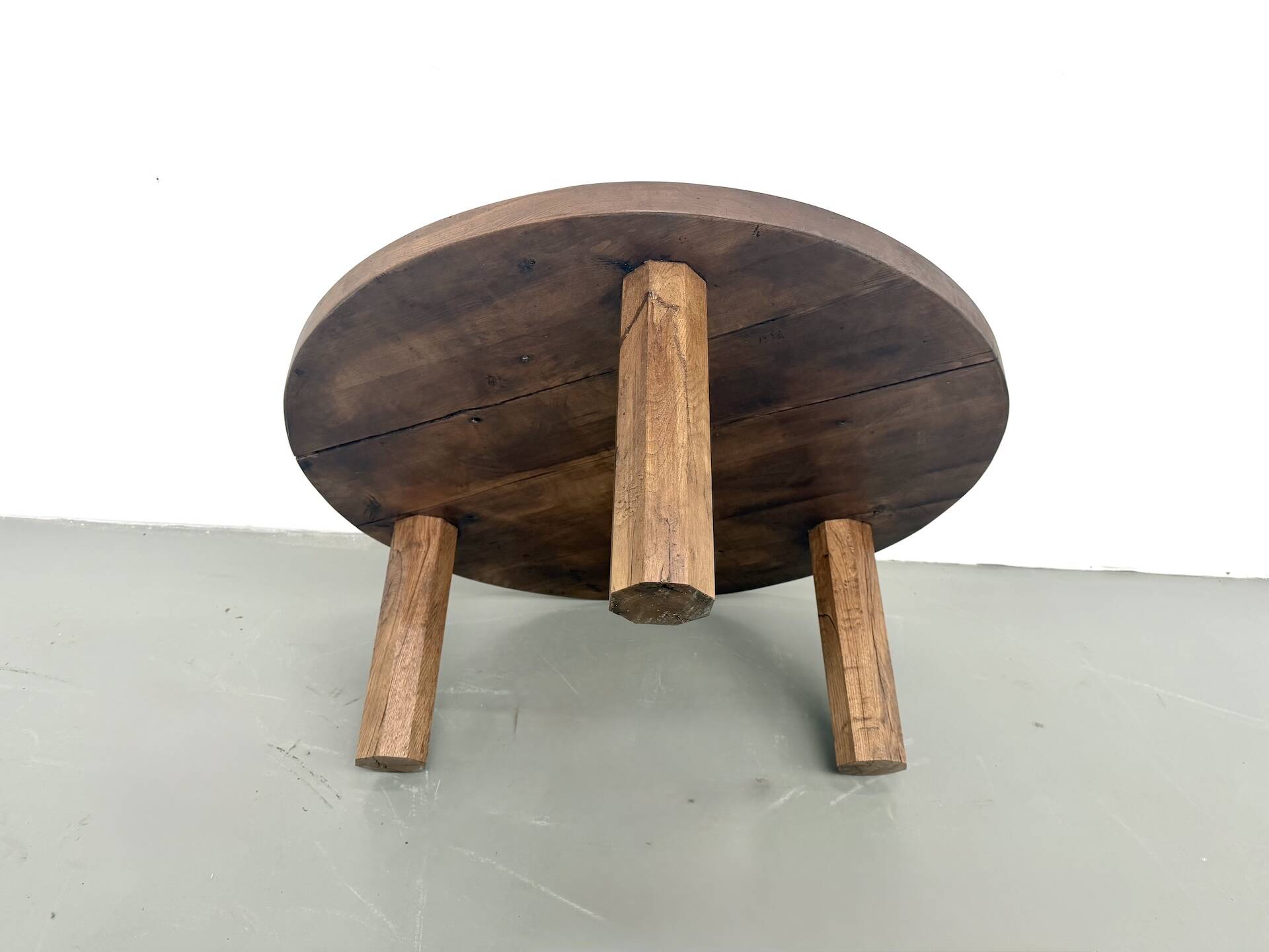 Round coffee table in solid oak, octagonal legs, France, 1950s.