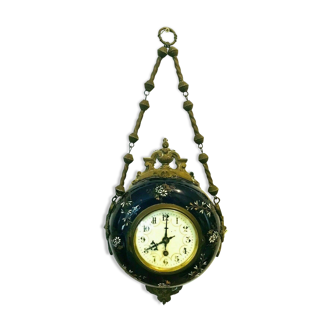 Enamelled earthenware wall clock Decoration and brass chain 20th century