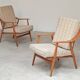 Pair of Boomerang-style armchairs in ecru beige fabric, 1960s.