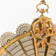 Bronze spark arrestor with fan-shaped openwork brass plates