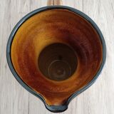 Orange glazed ceramic pitcher