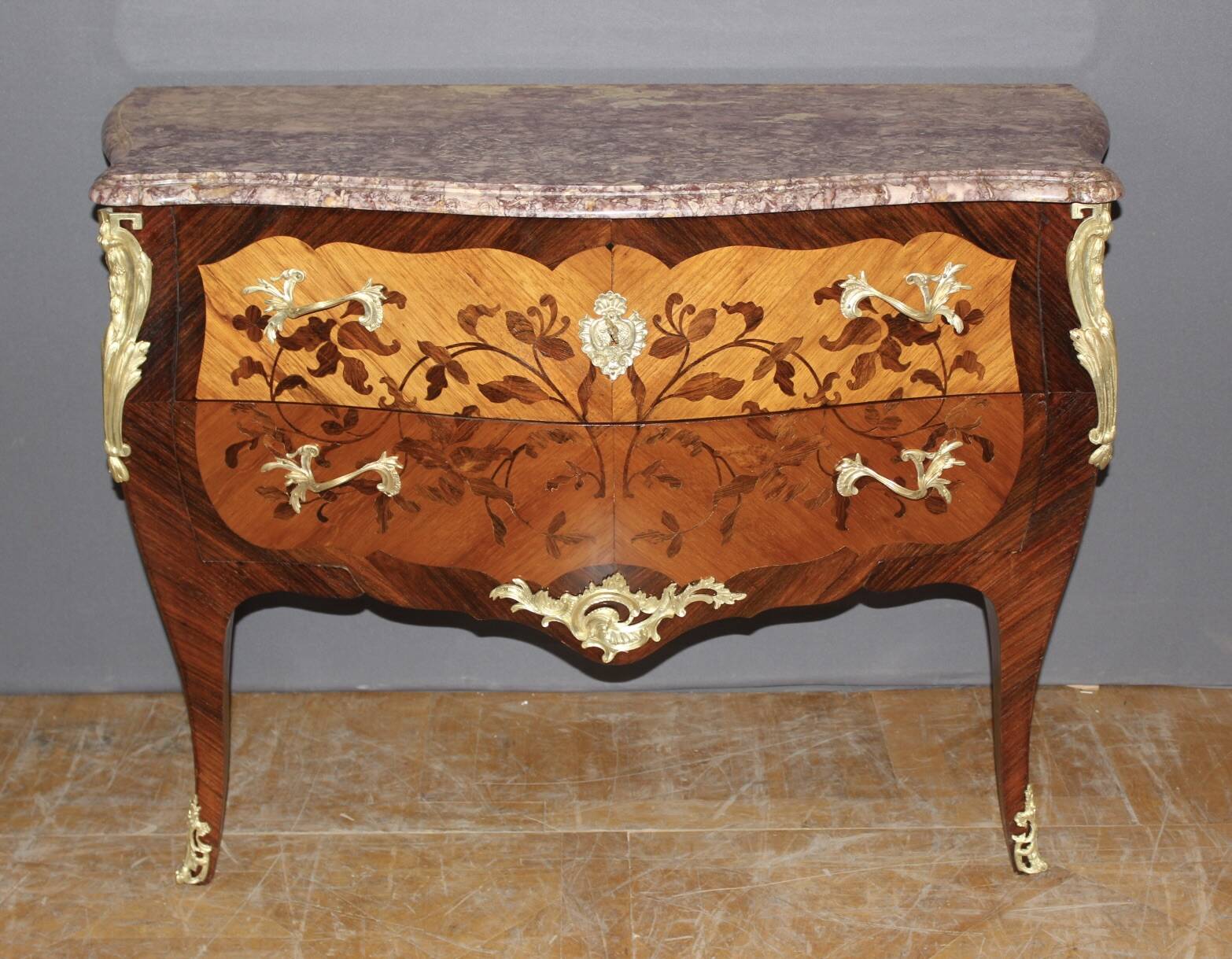 Louis XV style commode in marquetry from around 1930.