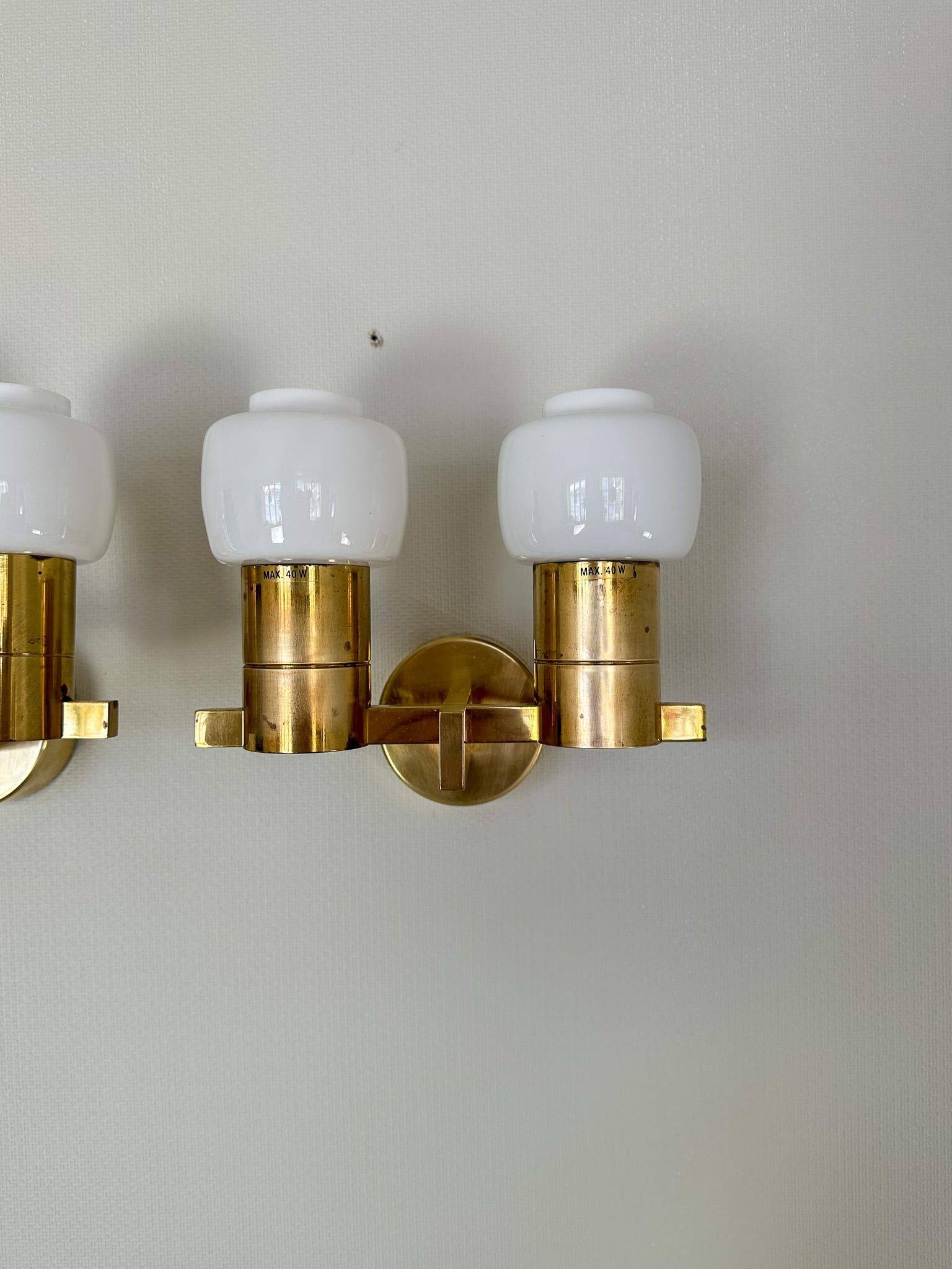 Brass and opaline glass wall lamps by Hans-Agne Jakobsson in mid-century style, Sweden, 1960s.