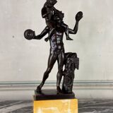 Dionysus on the shoulders of a satyr, bronze after the antique on a yellow Siena base.