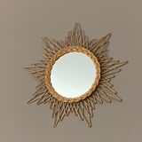 Mirror sun in braided rattan.