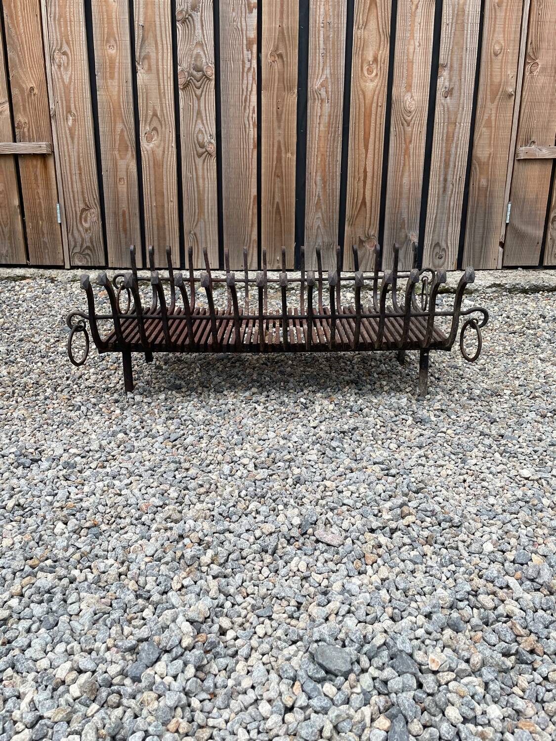 Vintage cast iron fireplace cradle with 16 bars.
