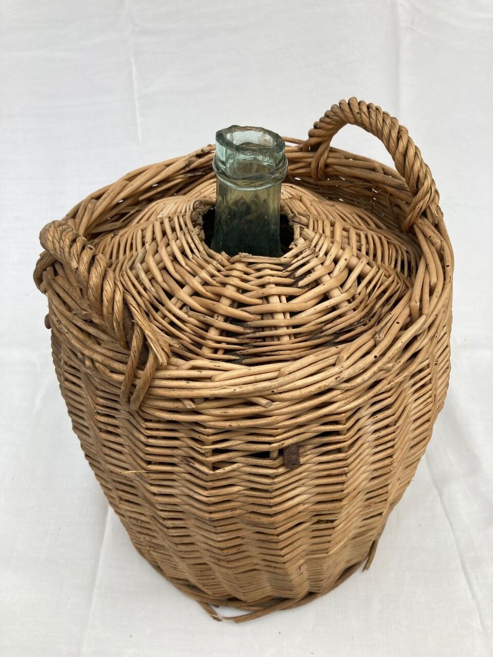 Demijohn type canister covered in wicker