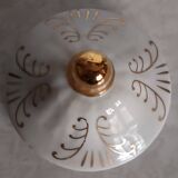 Golden porcelain teapot and coffee pot set with floral design and matching milk jug.