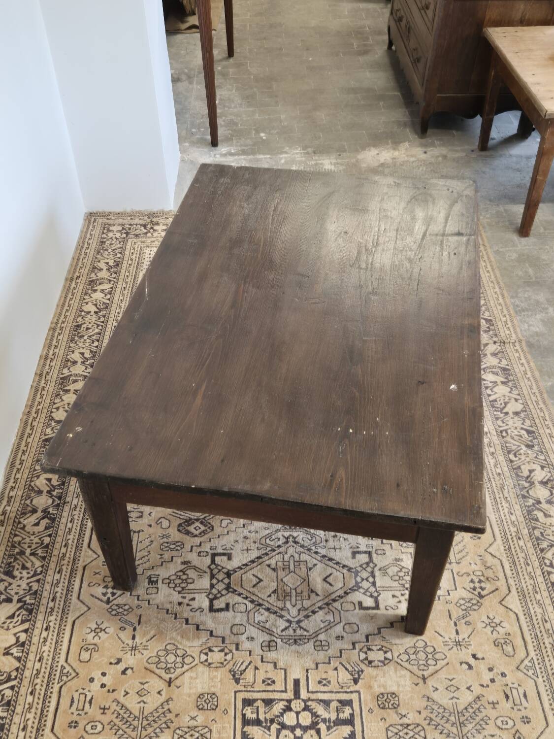 Rustic farmhouse coffee table from the 1900s with two drawers.