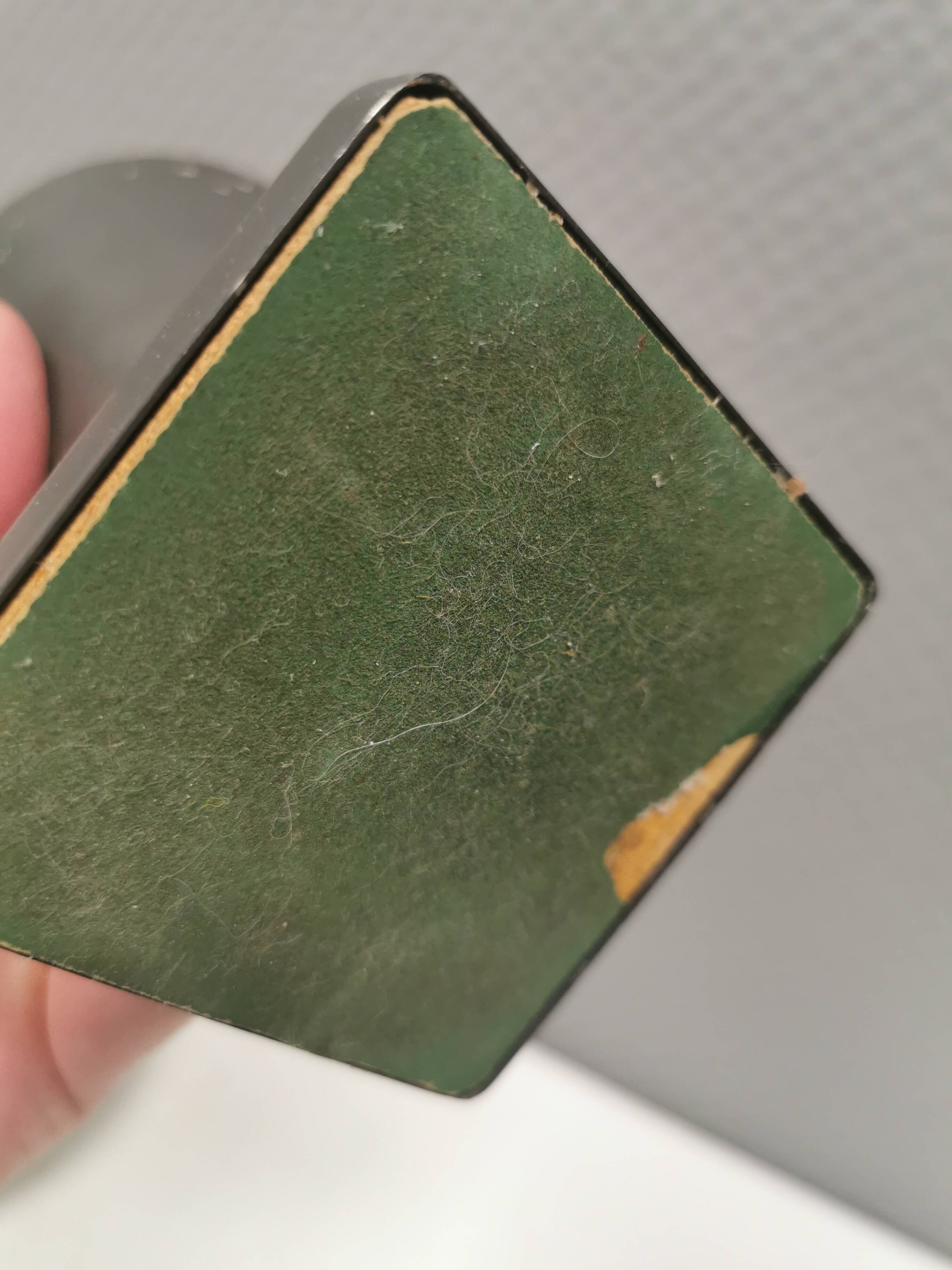 Small stylish table lamp with perforations and milky white opal glass shade