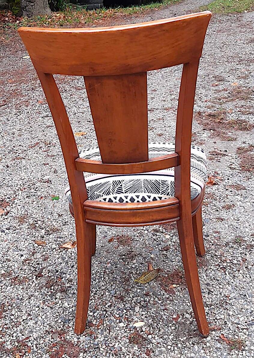 2 varnished solid wood chairs with "ethnic" padding