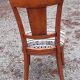 2 varnished solid wood chairs with "ethnic" padding