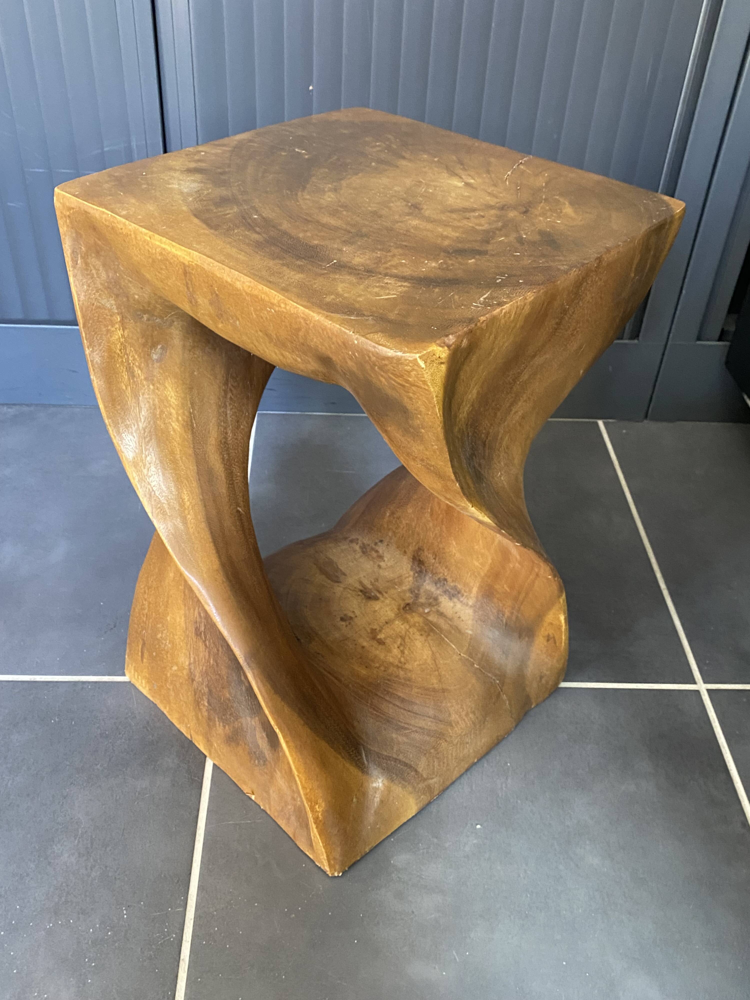 Stool no. 1 in solid raw walnut wood, carved from the mass, 1970.