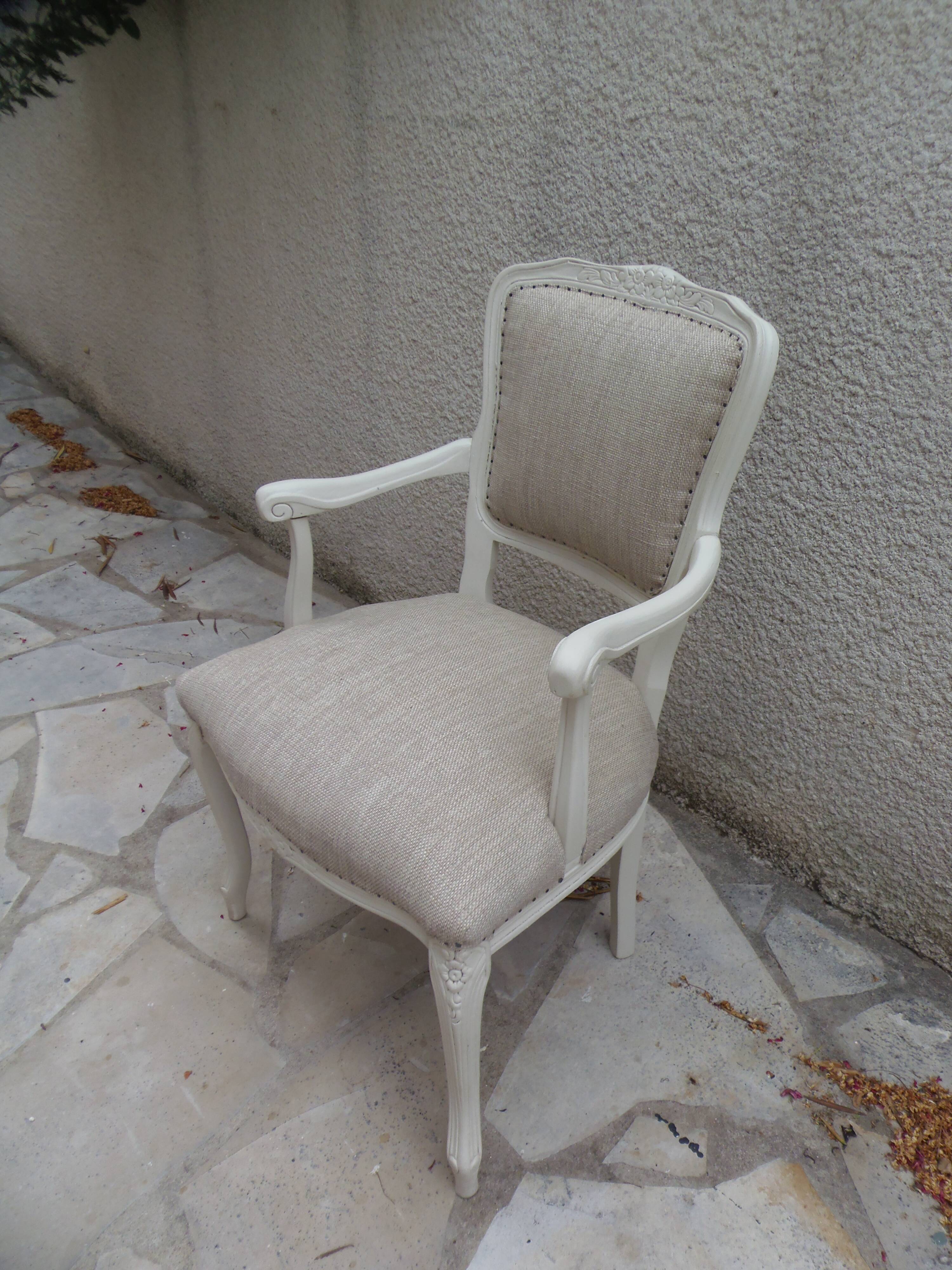 Louis XV style armchair in patinated beige, upholstered in beige fabric.