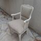 Louis XV style armchair in patinated beige, upholstered in beige fabric.
