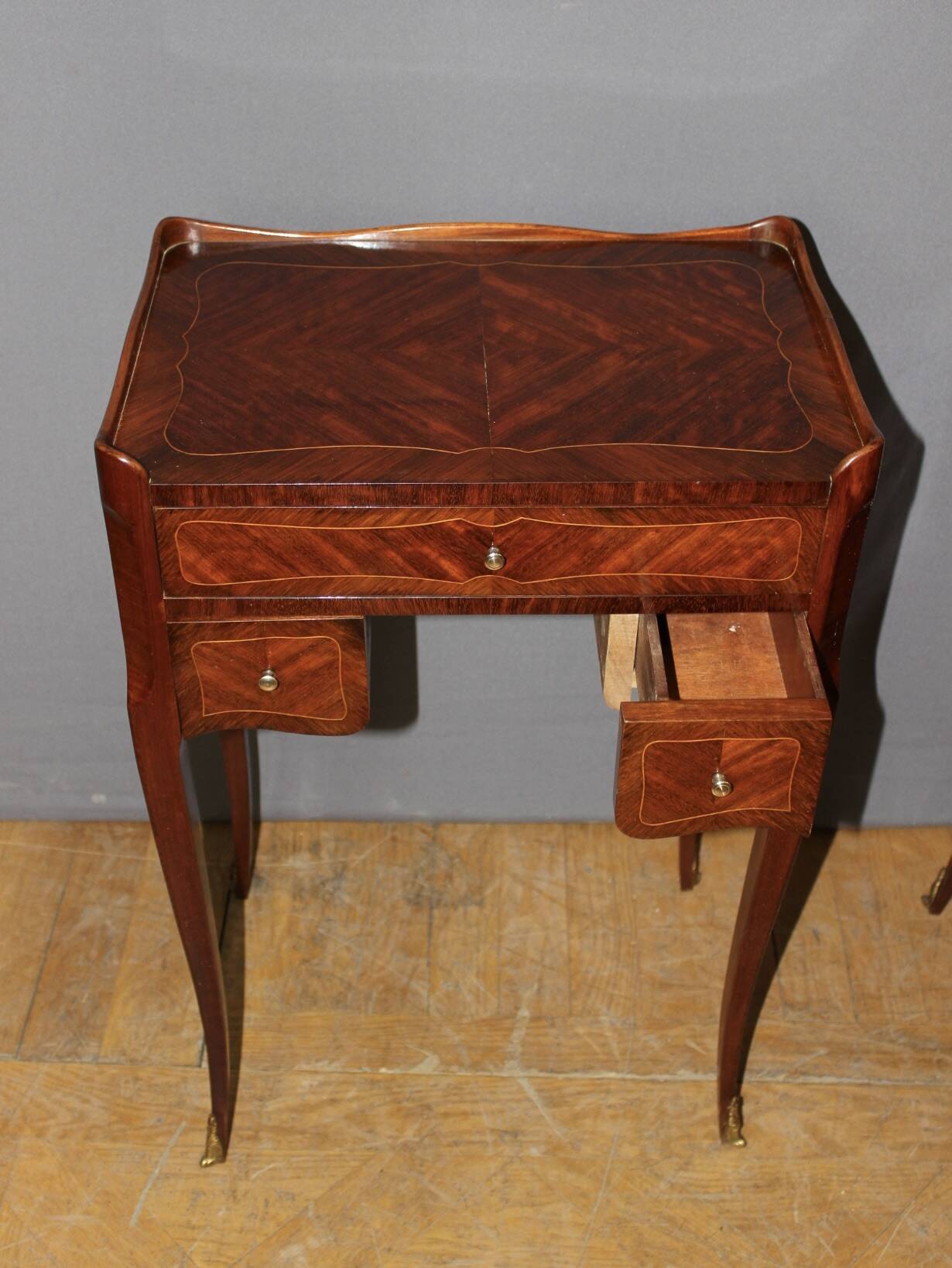 Pair of Louis XV style bedside tables in marquetry, 20th century.