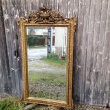 Wooden fireplace mirror and Gilded Louis XVI-style plaster with leaf