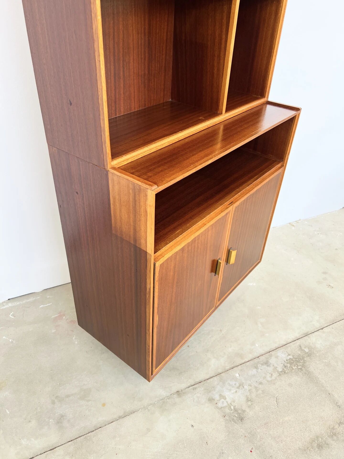 Mahogany library — closed storage and open cubbies, custom-made, 1960s.