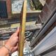 Small vintage mirror in gilded wood, bevelled glass with chain.