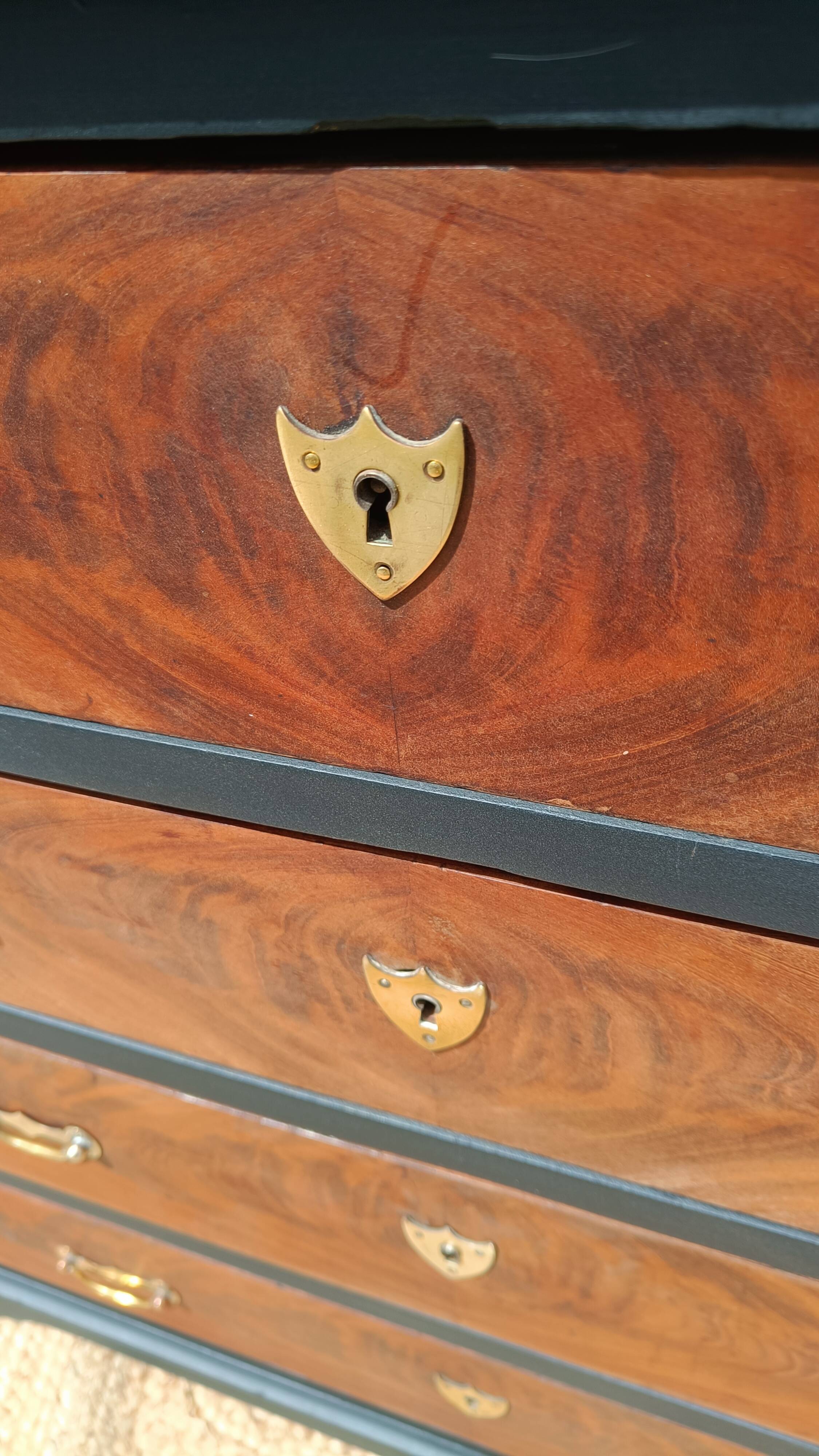Vintage commode revamped in matte black & wood with warm tones.