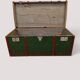 Vintage wooden and metal green travel trunk, circa 1930.