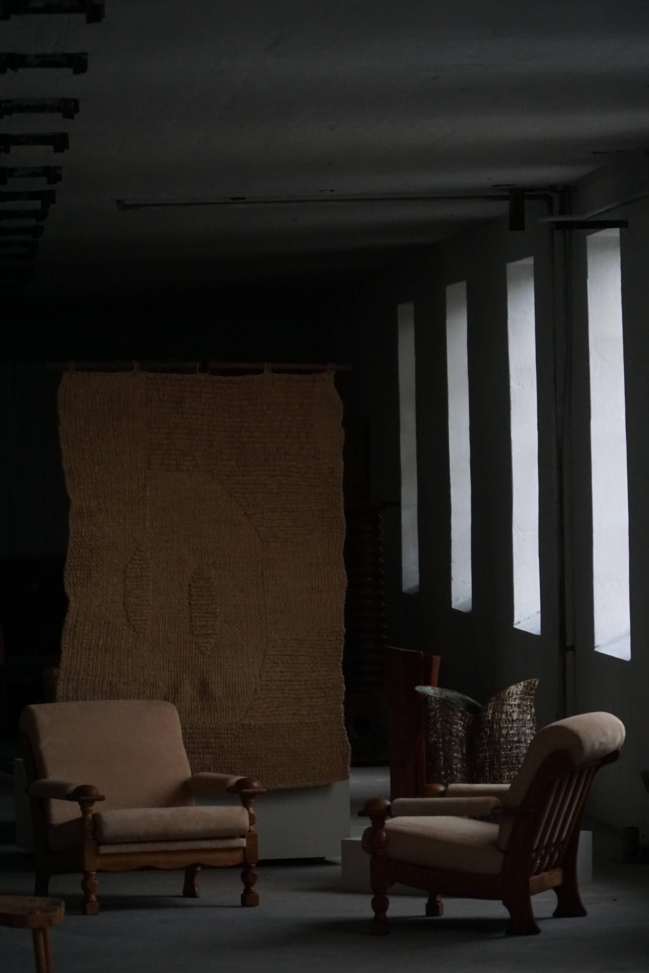 Mid-20th century, pair of armchairs by Henning Kjærnulf, oak and alcantara, 1960s.