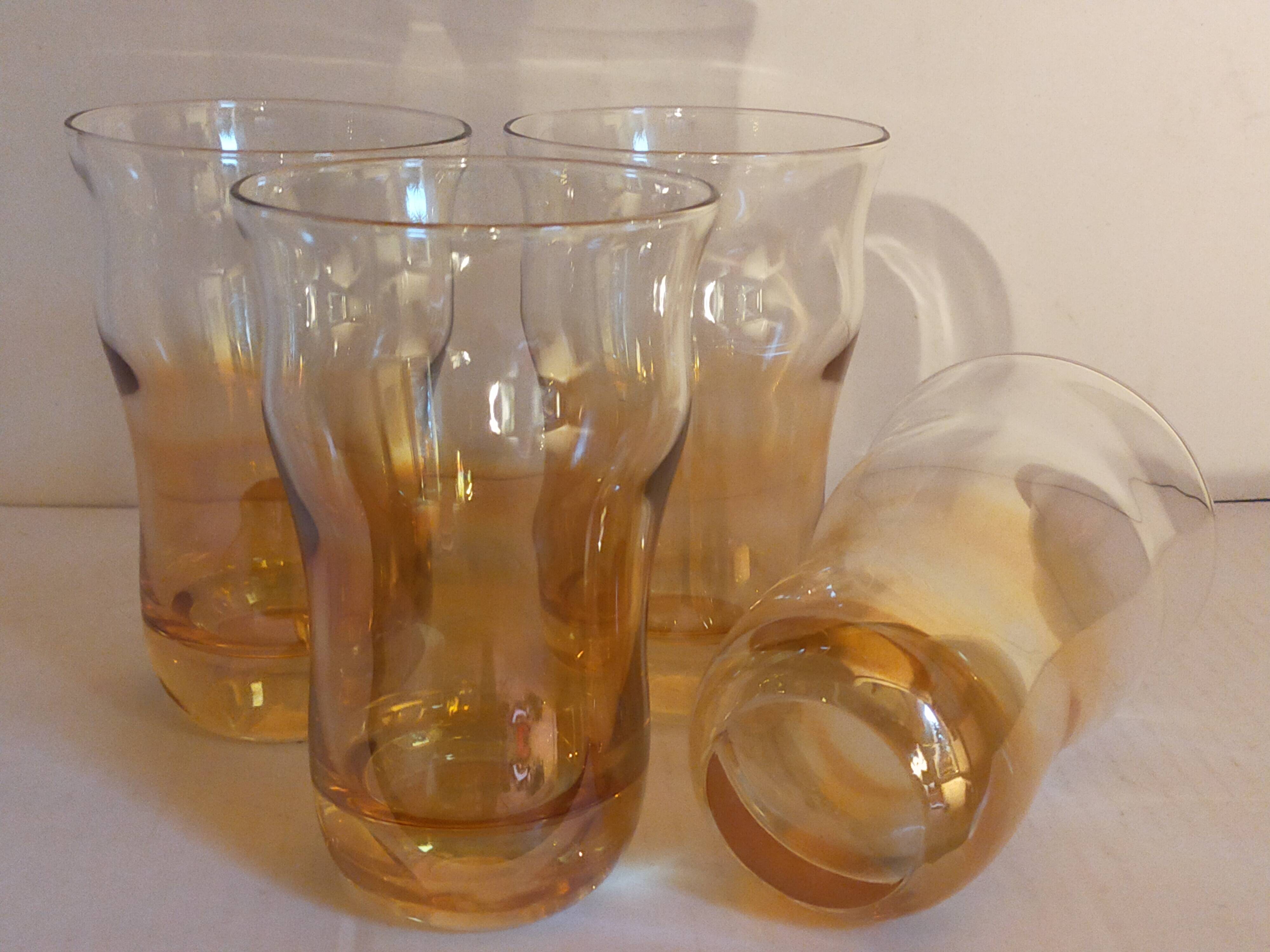 Four iridescent honey blown glass glasses