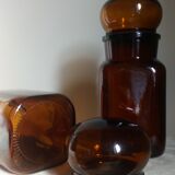 Duo of vintage apothecary bottles in amber glass
