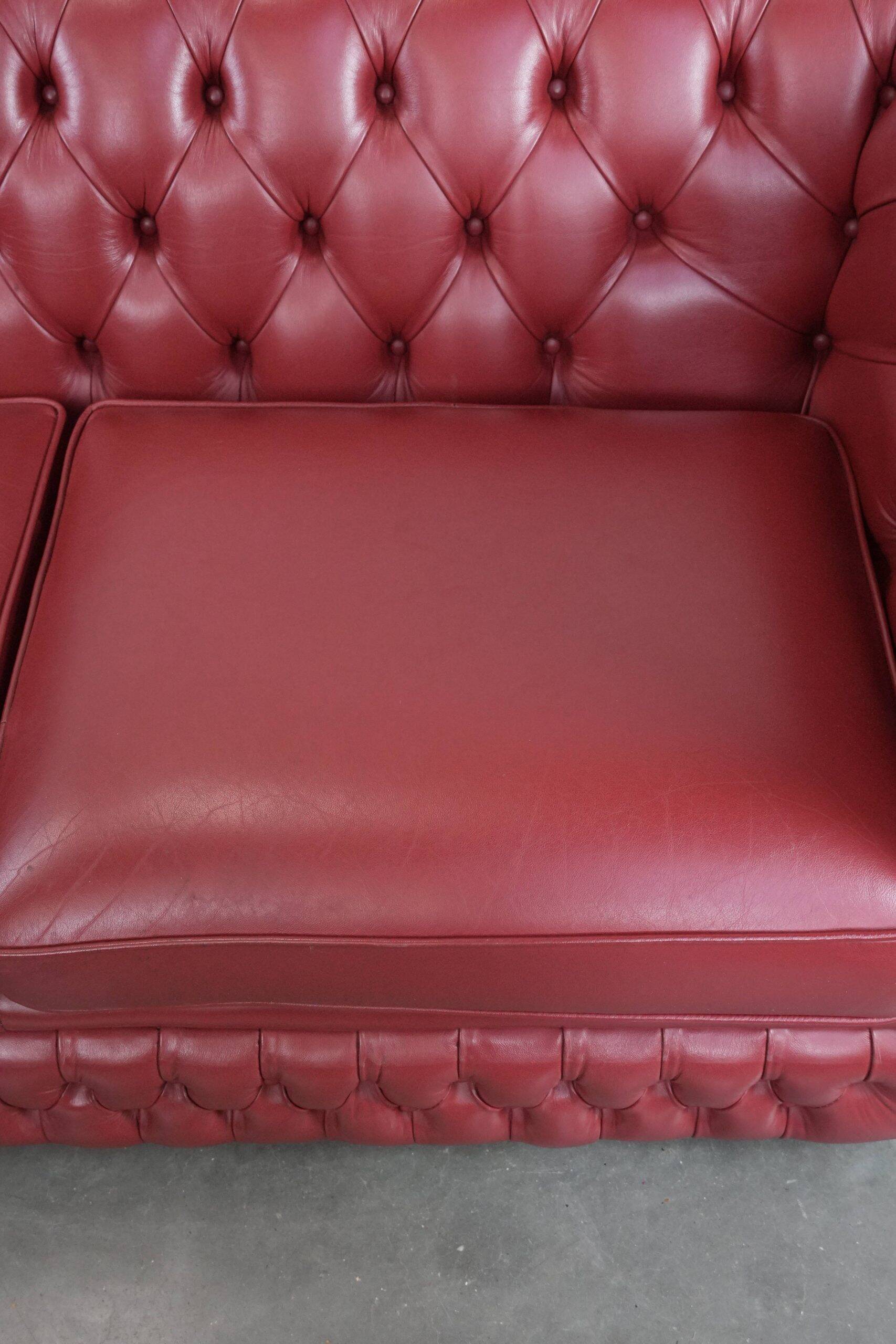 English cowhide Chesterfield 2.5-seater sofa in a stunning red colour
