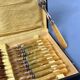Brass and yellow galathite cake forks
