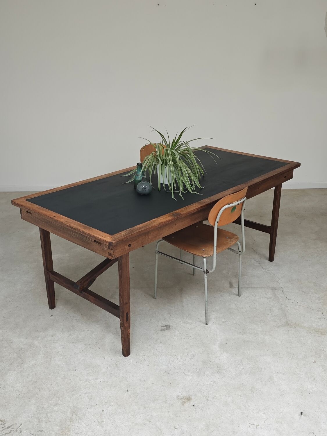 Vintage workshop folding table in oak with a hand-patinated black top.
