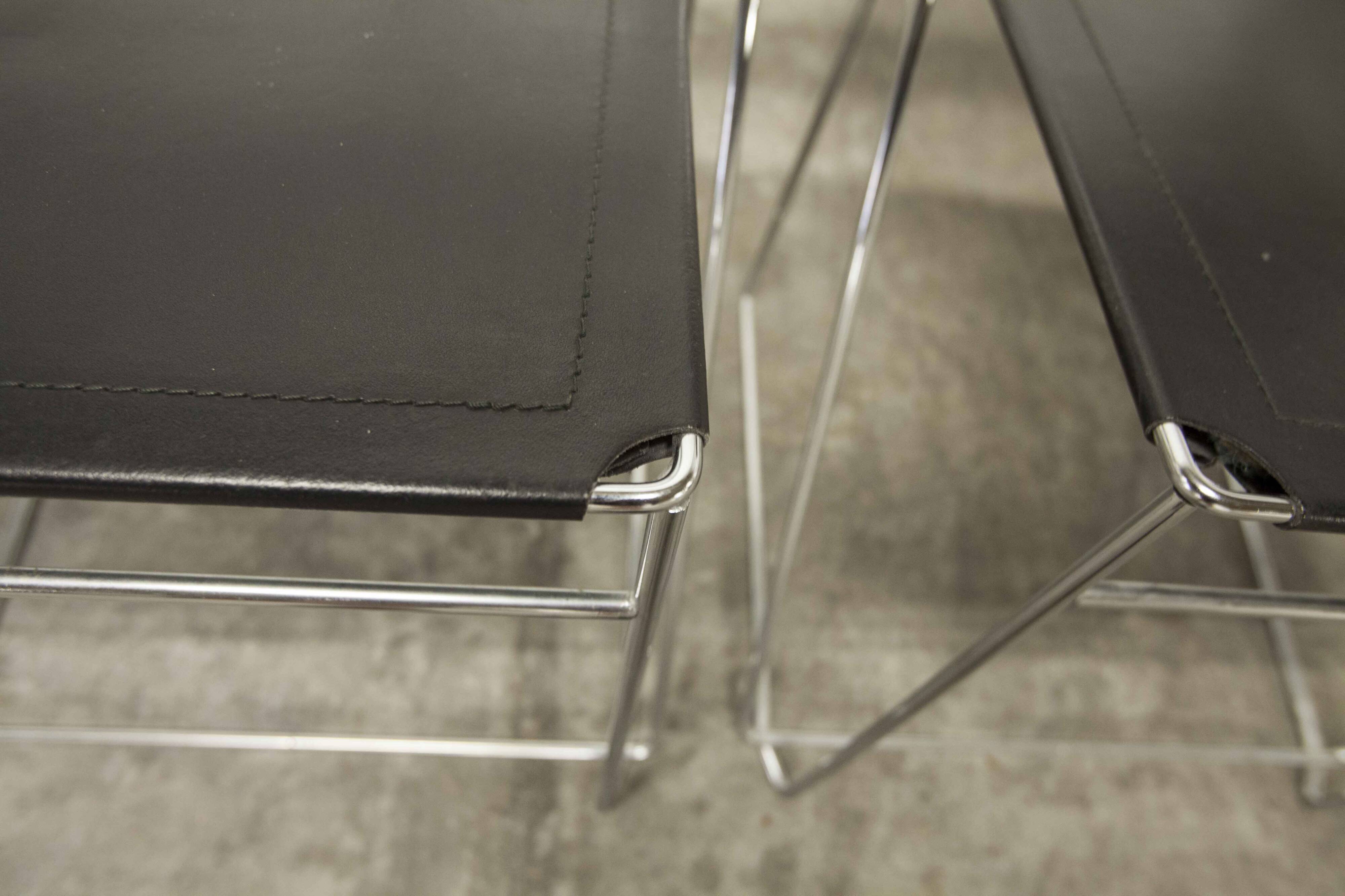 Set of 3 minimalist X line chairs by Niels Jorgen Haugesen.