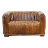 Cognac-colored cowhide 2-seater designer sofa finished with piping