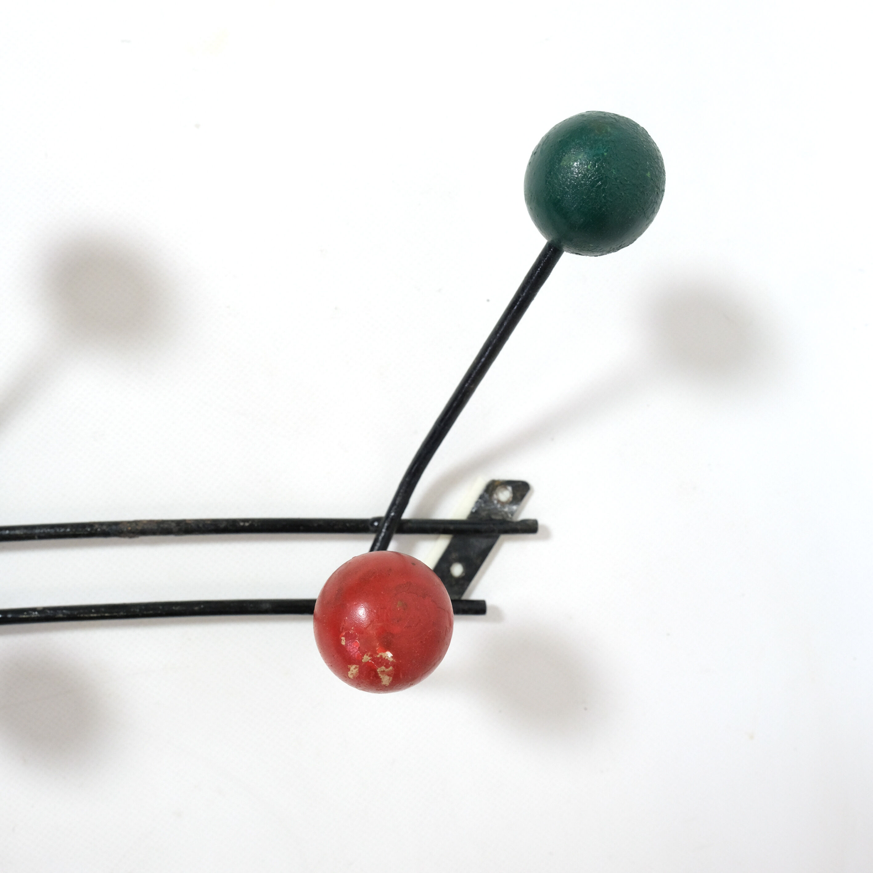Multicolored wooden and metal coat holder