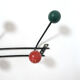 Multicolored wooden and metal coat holder